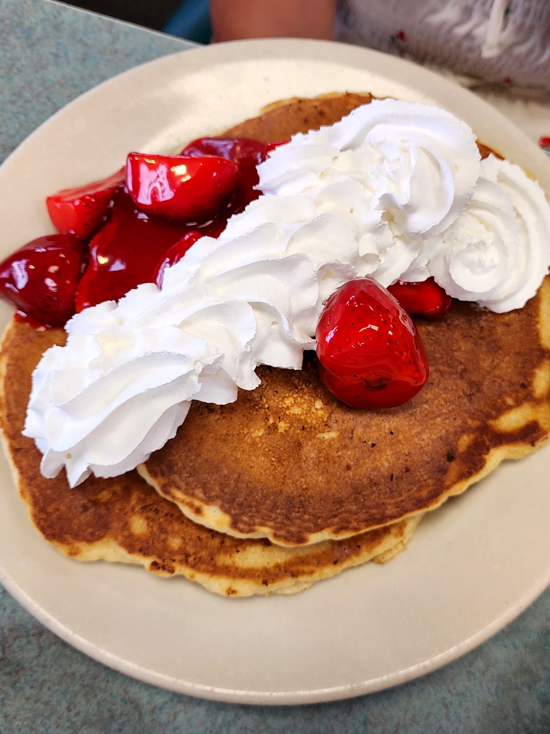 Strawberry pancakes with whipped cream at Golden Bear Restaurant in Largo, Florida